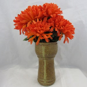 Studio pottery vase. A cup- or goblet-shaped vase in brown with yellow streaks.