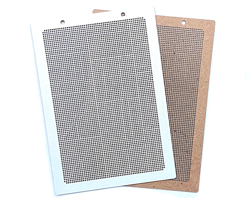 May include: Two rectangular craft stencils, one white and one brown, with a grid pattern. The stencils are made of a sturdy material and are perfect for creating intricate designs.