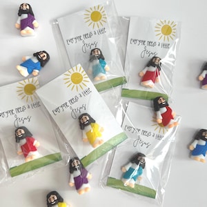 An “Everyone needs a little Jesus” figurine, religious gift to share Jesus. Little Jesus Pocket Card. Perfect Faith Gift.