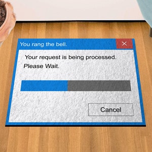 May include: A blue and white doormat with a computer error message that says "You rang the bell. Your request is being processed. Please Wait."  The message has a progress bar and a "Cancel" button.