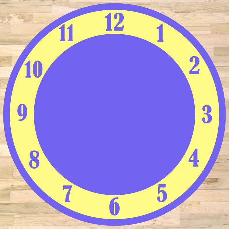 May include: A large, round clock face with a purple center and a yellow outer ring. The numbers 1 through 12 are printed in white on the yellow ring.