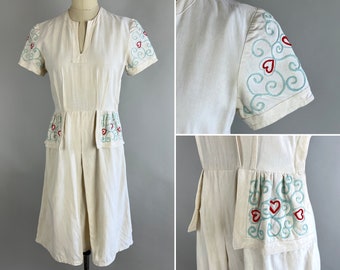 1930s Cupid's Target Dress | Vintage 30s White Cotton Linen Day Frock with Blue and Red Novelty Heart & Swirl Embroidery and Pockets | Small