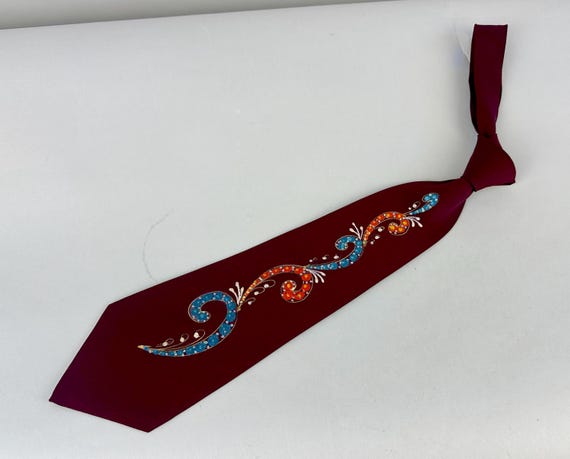 1940s Curls Unfurls Necktie | Vintage 40s Burgundy Red Rayon Crepe Self Tie Cravat with Hand Painted Textured Vine in Blue & Orange Sparkle