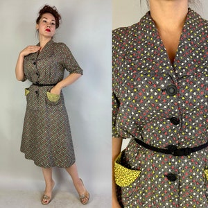 May include: A vintage dress with a black and white polka dot pattern and yellow accents. The dress has a collared neckline, short sleeves, and a button-up front. It features two large patch pockets with yellow trim and a black belt.