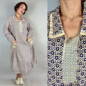 May include: Vintage dress with a blue and white geometric pattern. The dress features a cream-colored collar and lace detailing on the bodice and pockets. It has long sleeves and a knee-length skirt, offering a classic, retro style.