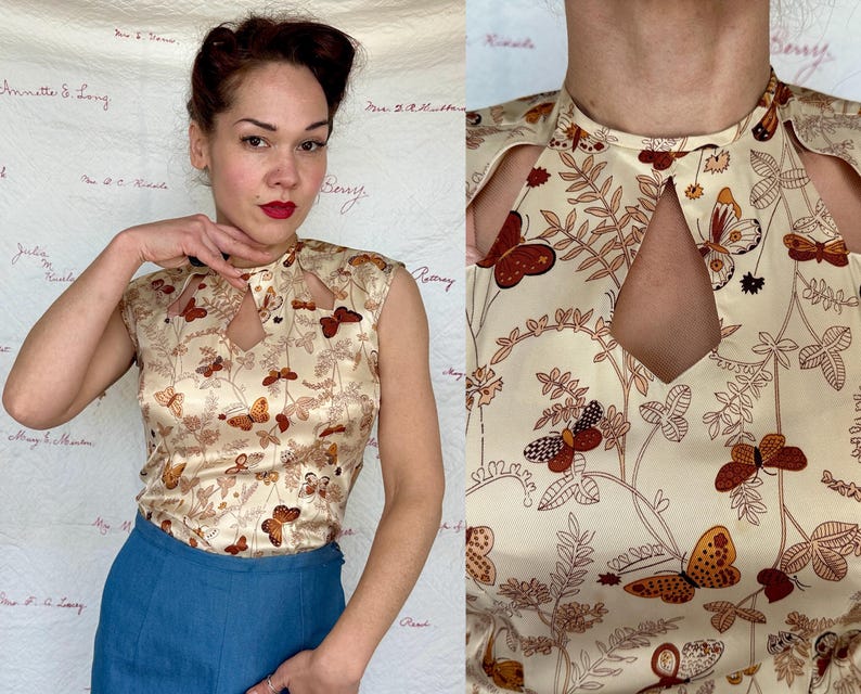 May include: A cream-colored sleeveless top with a keyhole neckline and a butterfly pattern in shades of brown and orange. The top is made of a silky material and has a vintage aesthetic.