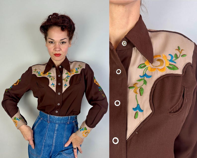 May include: A long-sleeve button-down shirt in dark brown with beige yokes on the shoulders and cuffs. The beige sections feature colourful floral embroidery in yellow, green, and blue. The shirt has a pointed collar and white snap buttons.
