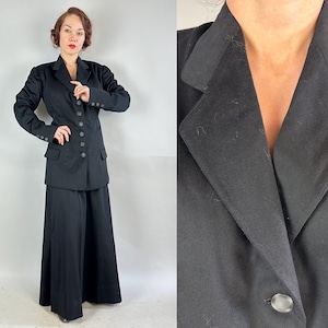 May include: A black double-breasted blazer with a long skirt. The blazer has a notched collar and button closures. The skirt is wide-legged and falls to the ankles.