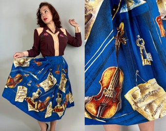 1950s Classical Virtuoso Novelty Skirt | Vintage 50s Blue Cotton Pleated Skirt with Violins Trumpets and Sheet Music Print | XS Extra Small