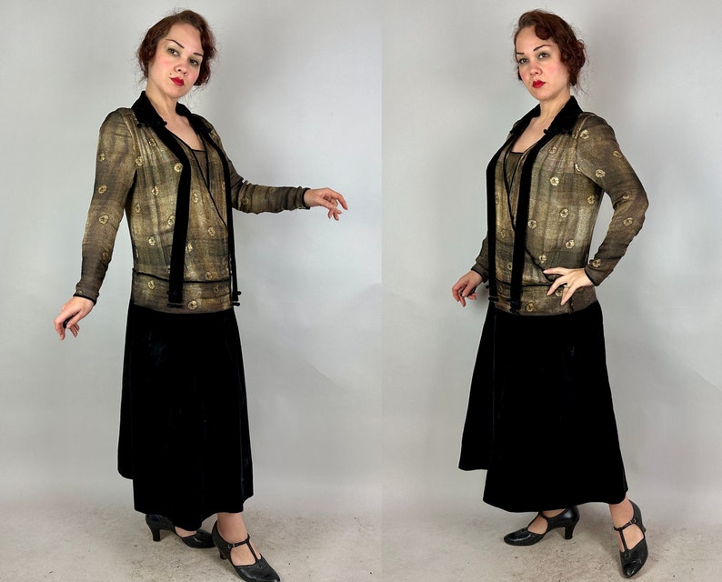 May include: A vintage-style dress with a sheer, gold-toned top and a black velvet skirt. The top features a geometric pattern and a velvet sash.