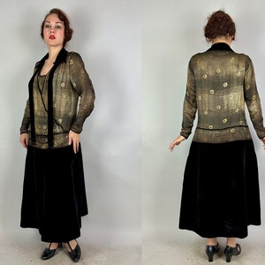 May include: A vintage 1920s dress with a gold and black patterned sheer top and a black velvet skirt.