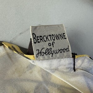 May include: A white fabric label with black text that reads "Bercktowne of Hollywood".
