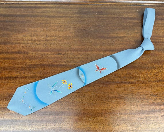 1950s Flight of the Butterflies Necktie | Vintage 50s Grey Rayon Hand Painted Sparkle Self Tie w/Orange Yellow Blue White Flower & Butterfly