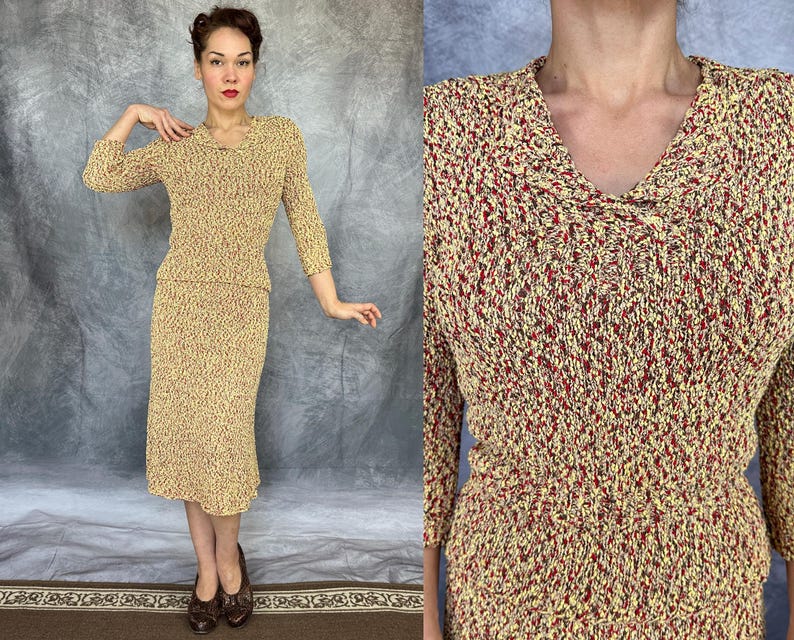May include: A vintage two-piece knit set in a speckled pattern of yellow, red, and brown. The top has a V-neck and three-quarter sleeves. The skirt is knee-length. The outfit is a classic example of mid-century fashion.