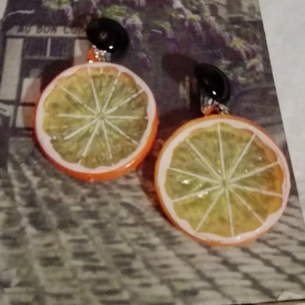 Orange ear clips made of plastic