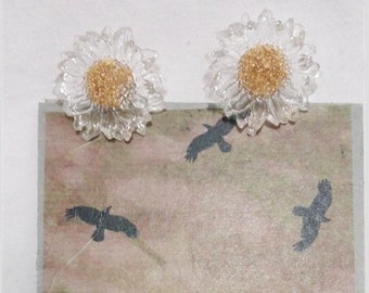 Transparent plastic daisy clip-on earrings