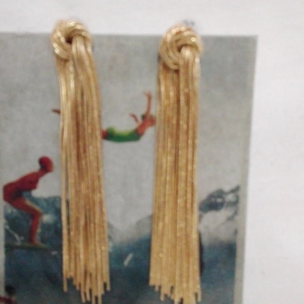 Long gold-plated metal earrings