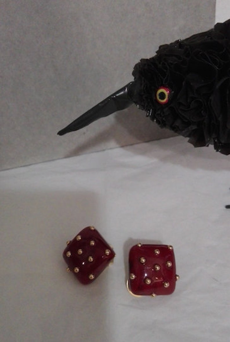Square plastic ear clips with golden beads