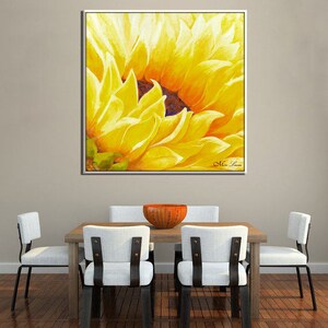 May include: A close-up of a yellow sunflower painting with a white frame. The painting is signed "Miss Lane" in the bottom right corner.