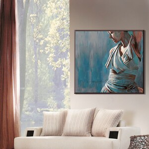 May include: A painting of a woman in a white dress with a blue background. The woman is standing with her back to the viewer and her head turned to the side. The painting is framed in a dark wood frame.