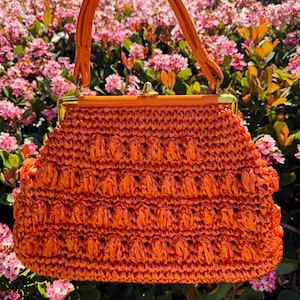 Bolso vintage de rafia naranja con asa superior, años 60