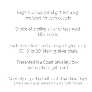 May include: Text describing a personalized necklace with beads representing each decade. The necklace is available in sterling silver or rose gold filled beads and comes in 16, 18, or 20 inch lengths. The necklace is presented in a Coast Jewellery box with an optional gift card.