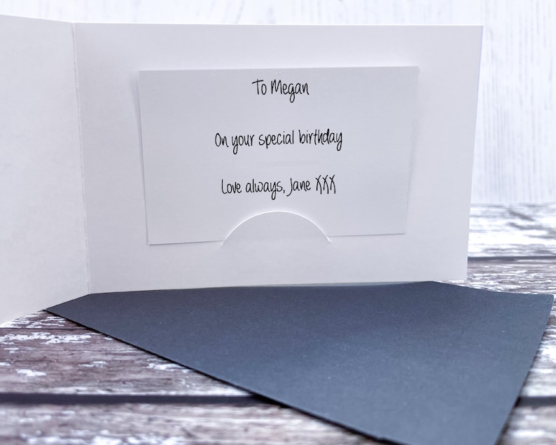 May include: A white card with a message inside. The message reads "To Megan, On your special birthday, Love always, Jane XXX".
