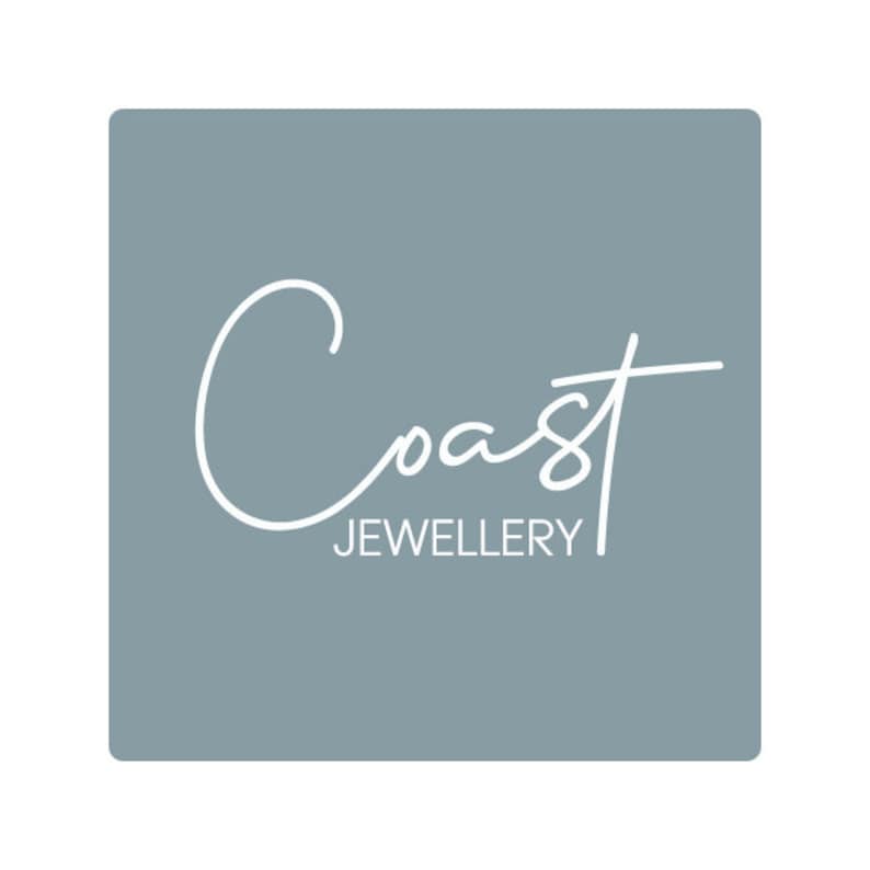May include: A light blue square with the word "Coast" written in white cursive script. Below the word "Coast" is the word "Jewellery" in white text.