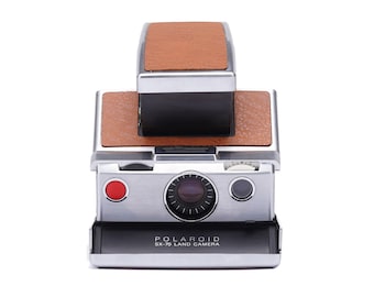Cámara instantánea Polaroid SX-70 vintage de los años 70, piel vintage original, marrón y plateada.