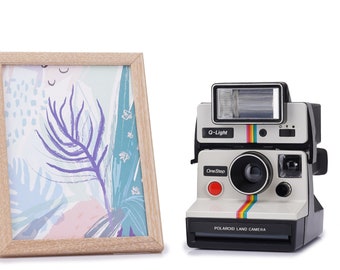 Vintage polaroid one step rainbow instant camera