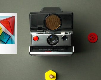 Vintage polaroid sx-70 instant film camera sonar silver/black landcamera polasonic autofocus