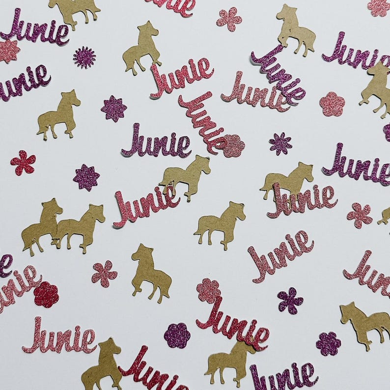 May include: Pink and gold glitter confetti with the name "Junie" and horse silhouettes.
