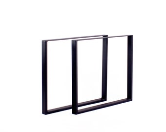 May include: Two black metal table legs with a square shape. The legs are made of sturdy metal and have a simple, modern design.