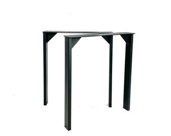 May include: A set of two black metal table legs. The legs are rectangular in shape and have a simple, modern design.
