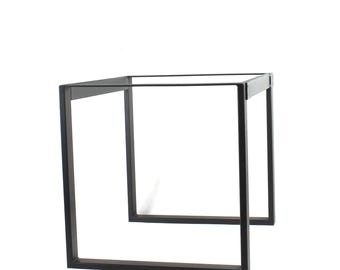 May include: Black metal table base with a square top and four legs. The base is made of sturdy metal and has a simple, modern design.