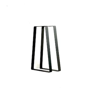 May include: Two black metal table legs in an A-frame shape.