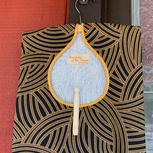 Vintage-style handmade w/ removable wooden hanger. Warm brown & black swirl pattern clothespin bag w/ golden trim. laundry organization.