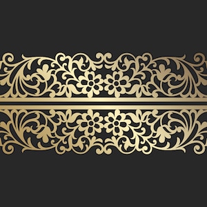 May include: A gold-coloured, ornate floral design with symmetrical patterns. The design features stylized flowers, leaves, and swirling vines, separated by a horizontal line, set against a dark grey background.
