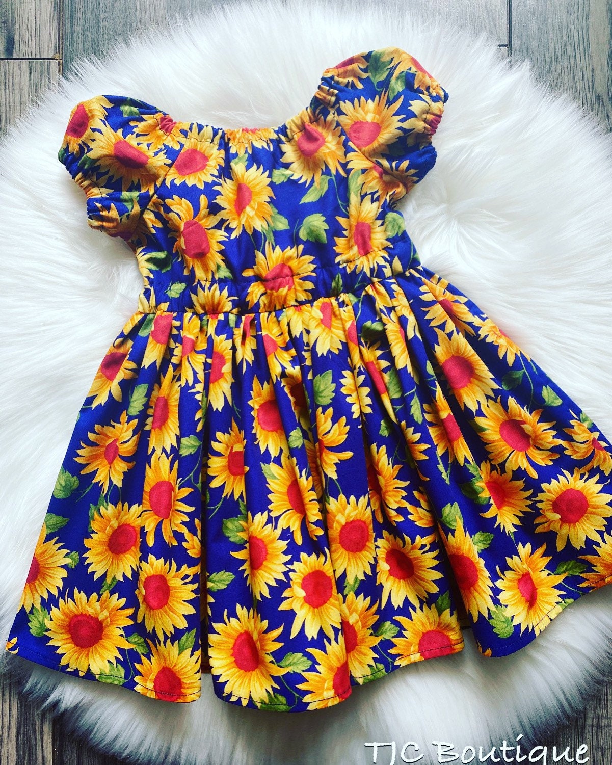 blue and yellow sunflower dress When it comes to summer vibes, our Michelle Sunflower Dress has got you  covered.  It brings all the sunshine, colour and good vibes this season,  the kind that make you want