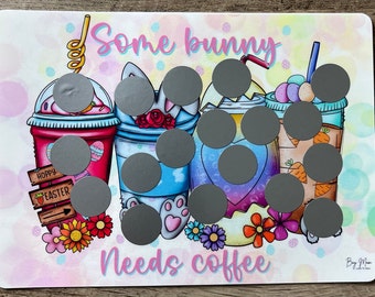 May include: A white background with a pink and blue design featuring four cartoon bunny-themed coffee cups with the text "Some bunny needs coffee". The cups have gray circles over them.