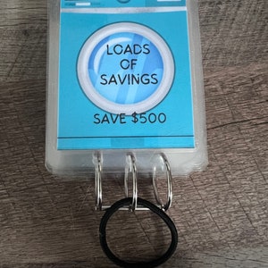 Sfida di risparmio di Loads Of Savings // Risparmia 500 // 25 buste plastificate da grattare // Sfida di risparmio per la lavatrice e il bucato