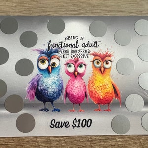 May include: A silver scratch-off card with three colorful owls and the text "Being a functional adult every day seems a bit excessive. Save $100."
