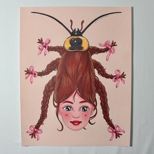 May include: Illustration of a cockroach with a woman's face and long brown braids adorned with pink bows. The insect's body is brown and yellow, set against a light pink background. The artwork is signed "Alice Snow 2023".