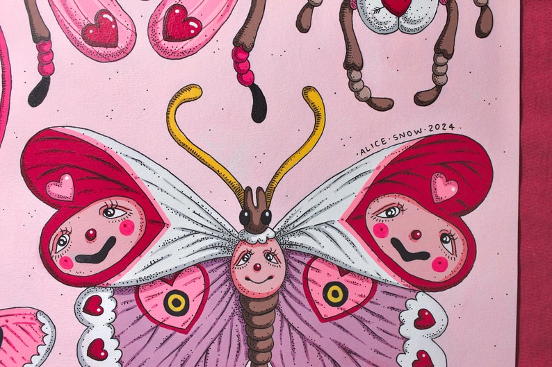 May include: A pink and red butterfly with a white face and a heart-shaped body. The butterfly has a yellow antenna and brown legs. The butterfly is surrounded by a pink background with white dots. The text "ALICE SNOW. 2024." is written in black at the bottom right corner of the image.