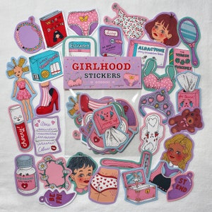 May include: A set of colorful stickers featuring various illustrations related to girlhood, including a diary, tampons, a teddy bear, a crown, and a heart-shaped sticker with the text "for tears!" The stickers are packaged in a clear plastic bag with a pink and purple label that reads "Girlhood Stickers".