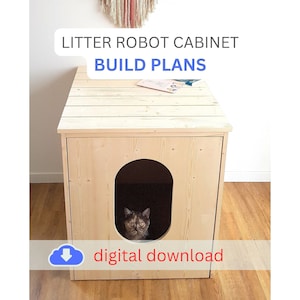 May include: A light-coloured wooden cabinet with an oval opening, designed for a Litter Robot. The cabinet has a flat top and a cat is visible inside the opening. Text on the image reads "Litter Robot Cabinet Build Plans" and "digital download".