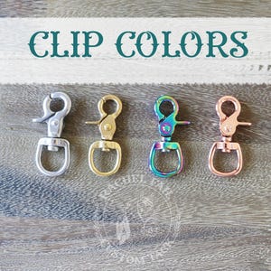 May include: Five different colored metal clips. The clips are silver, gold, iridescent, and copper.