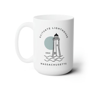May include: White ceramic mug with a black and white illustration of a lighthouse with the text "Scituate Lighthouse 1811 Massachusetts" around it.