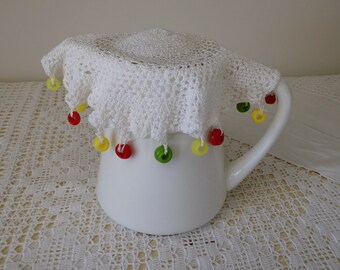 Vintage white crocheted and beaded jug cover