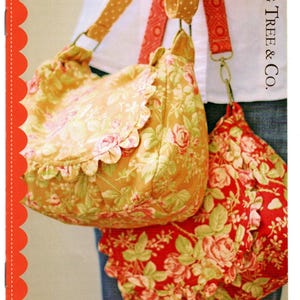 May include: Two floral print bags with scalloped edges and matching straps. One bag is mustard yellow with pink roses, the other is red with pink roses. The text "Prairie Rose" and "Great Girlie Style with a classic look" is visible.